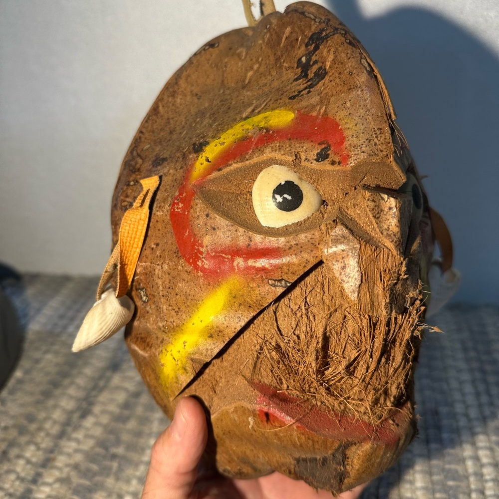 Handcrafted Tribal Mask with Colorful Accents made from coconut